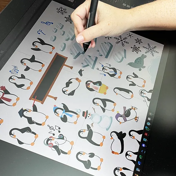 Liz draws penguins